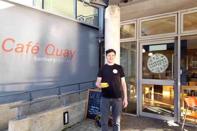 Callum Smith stands in front of the Pavement Coffee Co. café in the town centre of Banbury