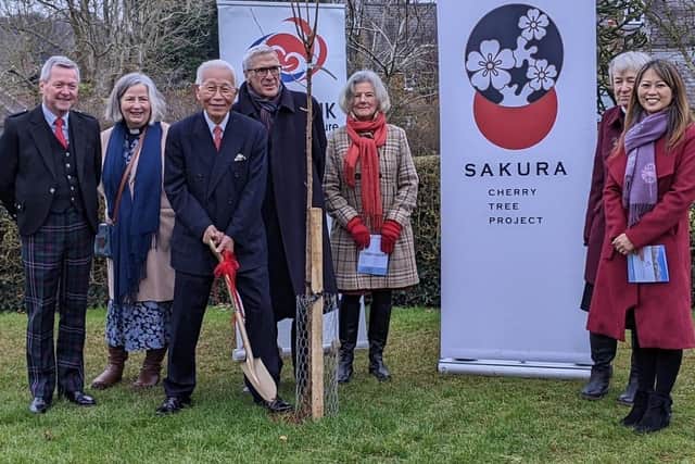 Keisaku Sandy Sano (with spade) officially presents Wroxton CE Primary School with 15 cherry trees. Also pictured, l-r are Geoff Fraser, Rev Alicia Baker, Dr Harvey Marcovitch and school governors Laura Robarts, Sue Neal and Marcia Yarborough