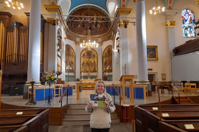 Rev Sarah Bourne, a chaplain for the arts, holds the brochure for the upcoming arts festival marking the 200th anniversary of St Mary's Banbury