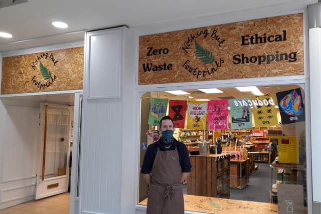 Daniel Ludlow stands in front of his zero waste shop Nothing but Footprints inside Castle Quay Shopping Centre in Banbury's town centre