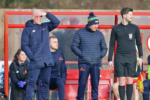 Ian Culverhouse and Paul Bastock watch on from the sidelines