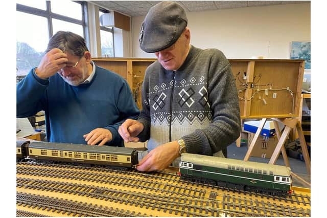 Jerry Lewis, the treasurer for the Banbury & District Model Railway Club, pictured with club member Keith Warr with trains on the club running track (Submitted photo)