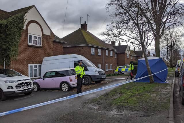 Thames Valley Police officers stand outside a property in Howard Road after a man was found stabbed late last night, Sunday February 13 (photo by Roseanne Edwards)