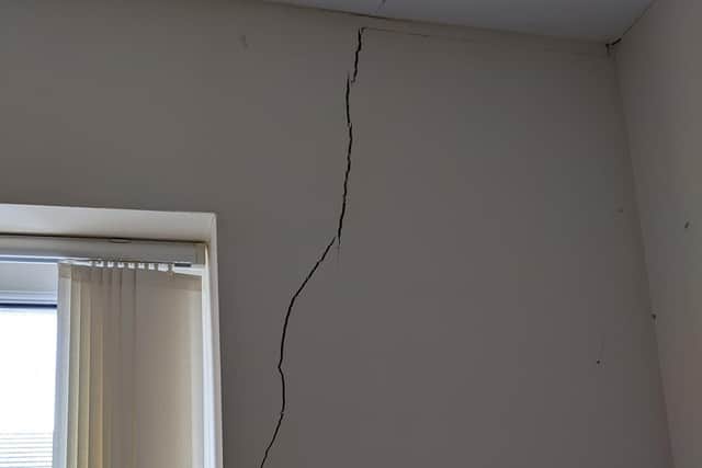 A huge crack in the wall of one of the owners of the homes in a cul de sac at Crouch Hill Road