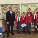 MP Jeremy Wright visited pupils at Kineton Primary School on February 4. The school has launched a new KPS Parliament with year six pupil Sam serving as the Prime Minister, Tallulah as the Deputy Prime Minister and other members of Parliament from left to right - Grace, Zara, Emma, Melissa, Oliver and William. (photo from Kineton Primary School)