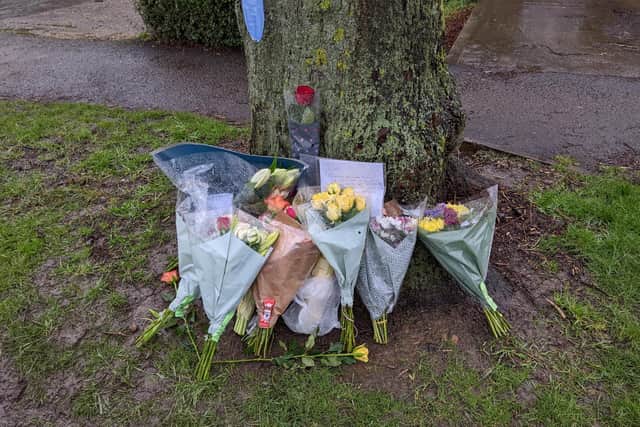 Bunches of flowers have been left outside the Howard Road home in Grimsbury, Banbury where a man was found fatally stabbed Sunday February 13 (photo by Roseanne Edwards)