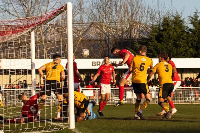 Max Dyche heads home Brackley Town's third goal in their 3-0 win over Bradford (Park Avenue) at St James Park. Picture by Glenn Alcock