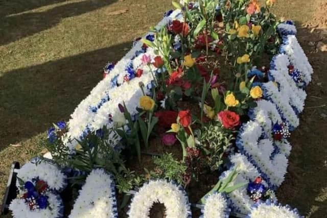 Floral tributes to cousins and friends Saqib Hussain and Mohammed Hashim Ijazuddin adorn the grave
