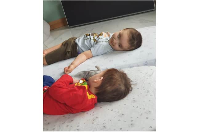 Zach and his brother Leo on the floor together (submitted photo)