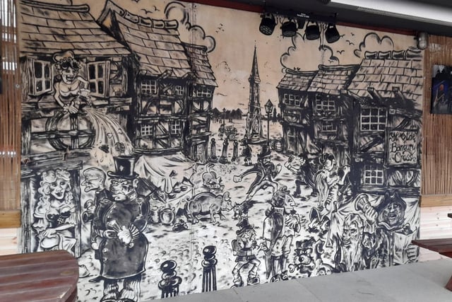 A mural in the back garden area of the Banbury Cross pub in Butcher's Row of the town centre. Mural by Steve 'Digger' Gardner.