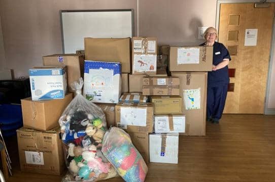 Boxed items from the Banbury Cross Health Centre with practice nurse Sue Hiam (submitted photo)