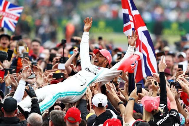 Lewis Hamilton celebrates with fans after winning the British Grand Prix at Silverstone in 2019. Photo: Getty Images