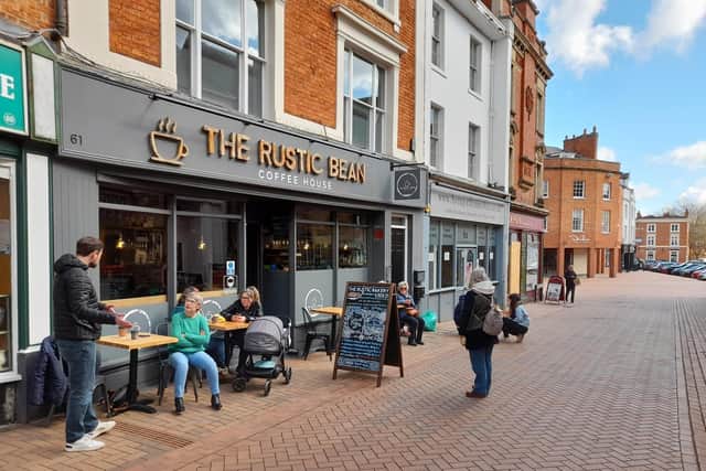 Customers enjoy a drink outside the Rustic Bean Coffee House in the Banbury town centre