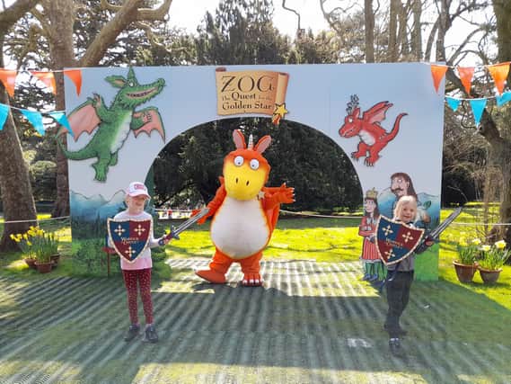 Eowyn and Hope Elofson pose for a photo with Zog at Warwick Castle