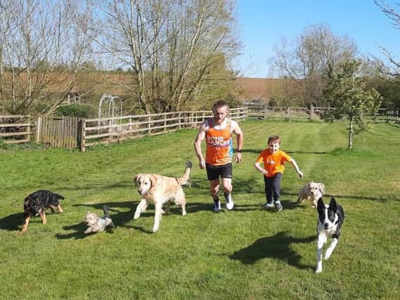 Rob Duffy and Freddie get some running practice in with the families' pets