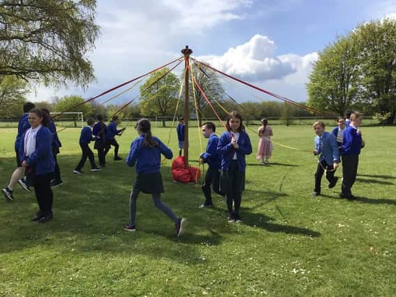Pupils at Wroxton Primary celebrate May Day (Image from Wroxton Primary)