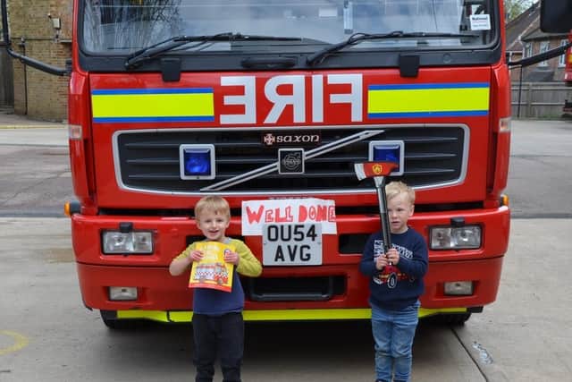 Kasper Hewitt and his friend Jack Jelley, both aged three, stand in front of the training fire appliance at the Banbury Fire Station on Friday April 30. (Image from Oxfordshire Fire & Rescue Facebook page with permission from mums)