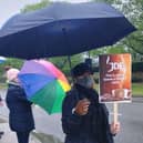 JDE workers with brollies hold a demonstration today (Saturday) outside the Ruscote Avenue main gate