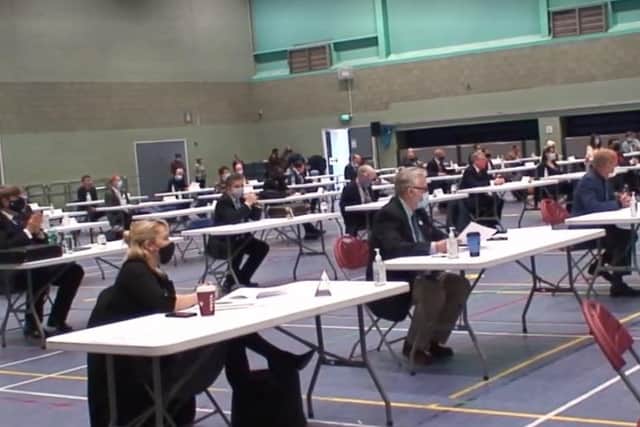 63 socially distanced councillors wore masks for the first Oxfordshire County Council meeting since the elections in the sports hall at the Spiceball Leisure Centre in Banbury (Image from David Lynch Twitter)