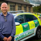 Gregory Edwards, vehicle commissioning unit manager, for South Central Fleet Services with some of the new fully electric emergency response vehicles