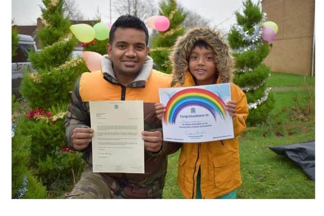 Prabhu received an Unsung Hero award in December from North Oxfordshire MP Victoria Prentis - Pictured: Prabhu Natarajan and his son, Addhu.