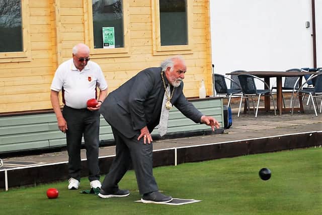 Mayor Chris Cartmell bowls a wood, just as Brackley’s mayor did in 1921 to open the club’s original green