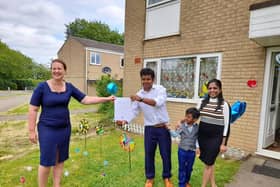 Banbury MP Victoria Prentis presents Prabhu Natarajan with his Points of Light award from the Prime Minister - pictured with his wife Shilpa Balachandran and son, Addhu.