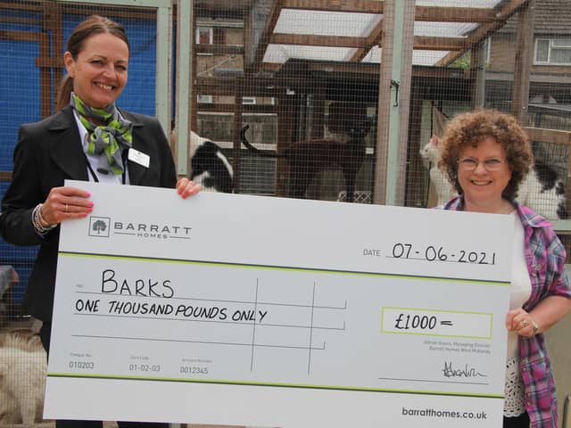 Pictured, from left, at the BARKS cat rescue centre in Bodicote, are Barratt sales adviser, Sarah Bennett, with BARKS Chair Ann Collins.