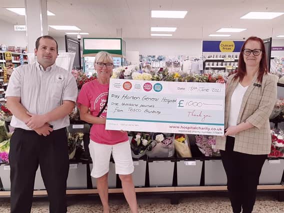 Tesco Extra in Banbury raised £1,000 for the Horton General Hospital through a fundraising raffle (pictured: Store manager Rob Twynham, Gail Williams from Horton Hospital and another store manager Sam Ions.)