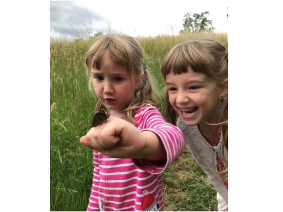 Children with a Hawkmoth - Beautiful charity butterfly walks are set to begin this week at Blackberry Farm near Shipston (Image submitted from the farm)