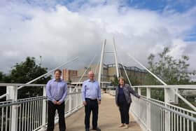 Pictured on the newly reopened Spiceball footbridge: Graham Bleach, Spiceball Leisure Centre manager, Cherwell District Cllr Phil Chapman and Cherwell District Cllr Lynn Pratt (submitted image from Castle Quay)
