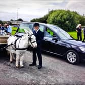 Banbury resident Malcolm 'the Donkey man'Weblin took his final journey ona London flatbed cart led by a little white donkey called Bobby. (photo by Tim Hill)