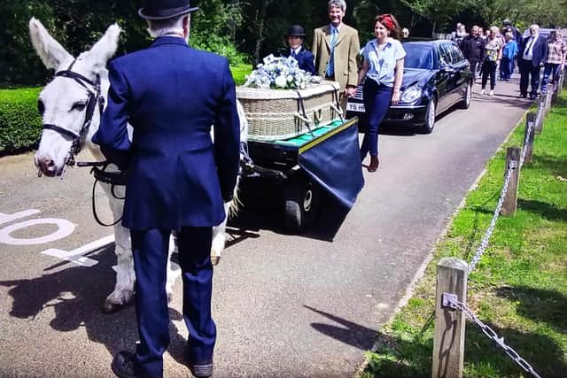 Banbury resident Malcolm 'the Donkey man'Weblin took his final journey ona London flatbed cart led by a little white donkey called Bobby. (photo by Tim Hill)