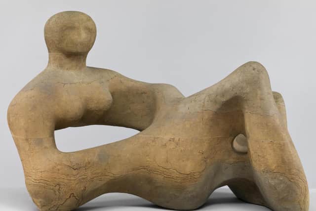 Recumbent Figure, a Henry Moore sculpture in of layers of Hornton stone. Picture the Henry Moore Foundation