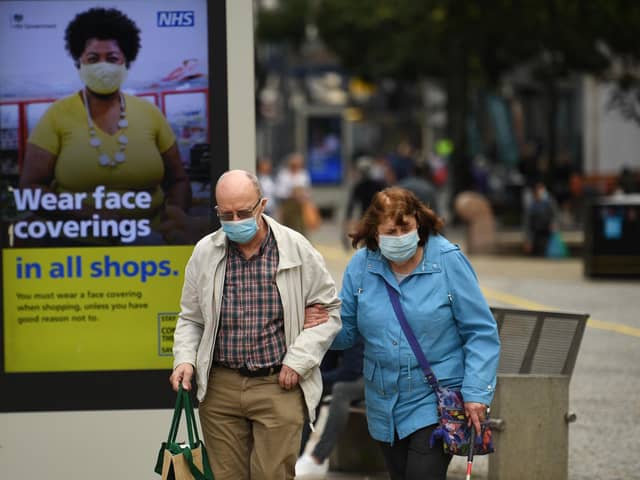 Restriction rules were relaxed today but in Banbury many shoppers still wore their masks. Picture by Getty