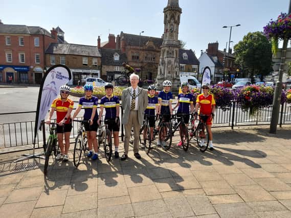 Members of the Banbury Star Cyclists' Club and the Team Cherwell Banbury Triathlon Club pose for a photo with Cllr John Howson, the chair of Oxfordshire County Council in Banbury