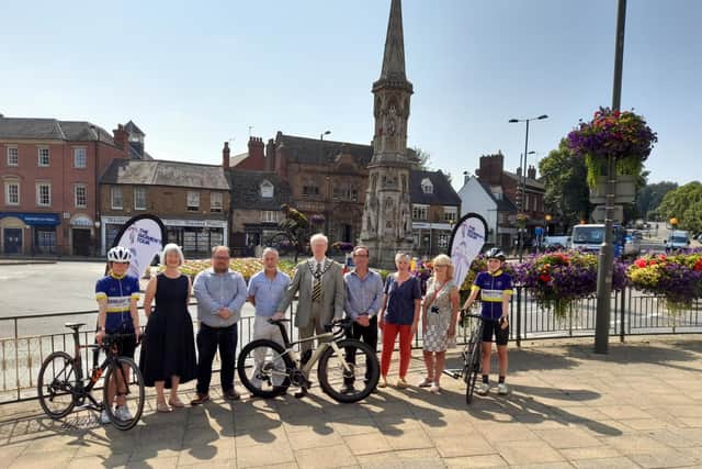 Members of local councils and organisations pose for a photo for the reveal of the route for the Women's Tour cycling race set for Oxfordshire in the autumn. (Pictured: Cllr Liz Leffman, leader of Oxfordshire County Council, Peter Hodges, public relations and marketing director for SweetSpot Group, Frank Smith the partnership services manager for Experience Oxfordshire, Cllr John Howson the chair of Oxfordshire County Council, Cllr Dan Levy, West Oxfordshire District Council, Sam Casey-Rerhaye, the cycling champion for South Oxfordshire District Council, Cllr Helen Pighills the cabinet member for healthy communities from Vale of White Horse District Council with members of the Banbury Star Cyclists' Club on each end)