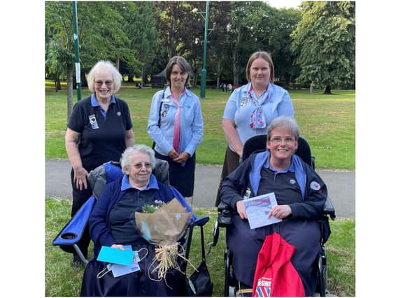 Madeline Gibbons presented with her 60 years of service award (Pictured: Madeline at bottom left, Alison is bottom right. Standing L-R Gwyneth Davies, unit leader, Mary Brodey, assistant county commissioner, Emily East the Cherwell Division Commissioner)
