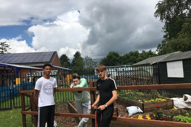 Wykham Park Academy Sixth Form student Adam Starkie, Rosie Troops and Aaron Speke at Harriers Primary School. (Image from Wykham Park Academy)