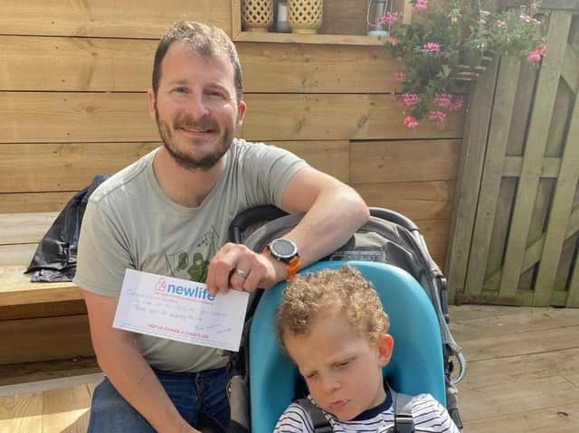 Gareth Birket and his son William. The family has won £750 of vouchers