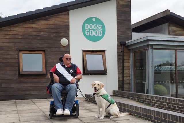 Simon Cook is pictured with his assistance dog Axel at Dogs for Good, Banbury