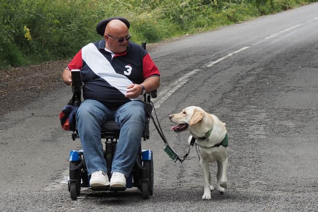 Assistance dog Axel has changed Simon Cook's life for the better