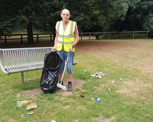 David Clare of Banbury Litter Pickers collects rubbish in a Banbury park
