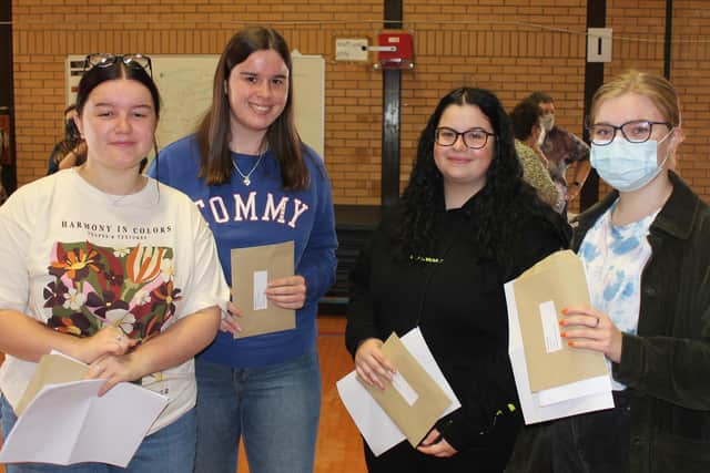 Isabelle Faulkner, second from left, is among the Chenderit School student who collected their A-level results Tuesday August 10 (Image from Chenderit School)