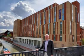 Cllr Ian Corkin, deputy leader of Cherwell District Council, stands in front of the new Premier Inn hotel set to open next week in the town centre of Banbury
