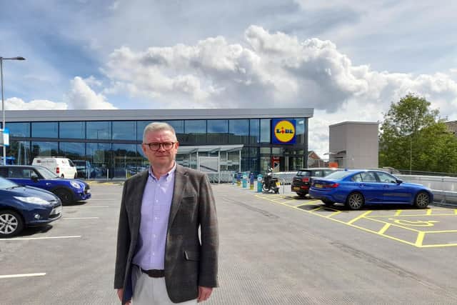 Cllr Ian Corkin, deputy leader of Cherwell District Council, stands in front of the new Lidl supermarket set to open this Thursday August 12 in the town centre of Banbury