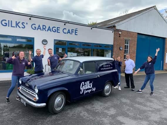 The staff from Kineton's Gilks' Garage Café stand around their new delivery van known as 'Cobby' (Image from Gilks' Garage Café Facebook page)