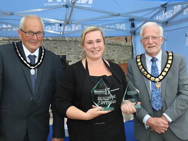Rebecca Martin, the owner of Berowbe Catering, was named named the NMTF’s Young Trader of the Year 2021 - pictured with NMTF National President Michael Nicholson (right) and President-Elect John Dyson (Image from the NMTF website)