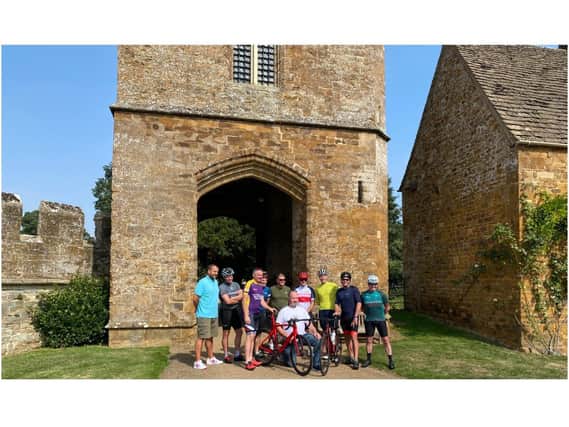 Andy Gill (kneeling) of new Banbury-based charity Dementia Active with members of the Kelly’s Heroes group who are cycling from Broughton Castle to Lands End to raise money for Dementia Active. (Photo from Martin Fiennes of Broughton Castle)