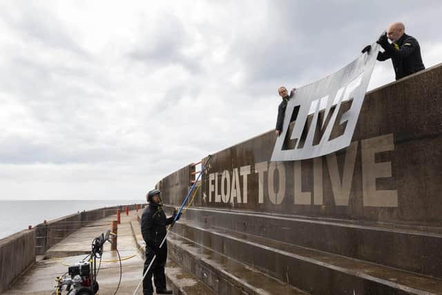 Float to live: RNLI and Kärcher UK share lifesaving message with sea wall art. (Photo credit: Kärcher UK)